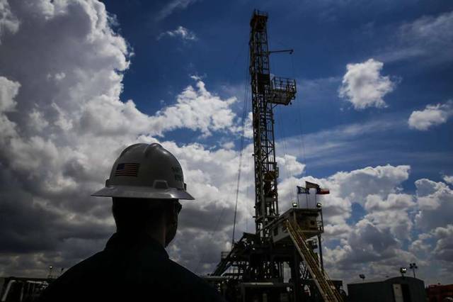 Oil climbs as Saudi Arabia renews commitment to cuts