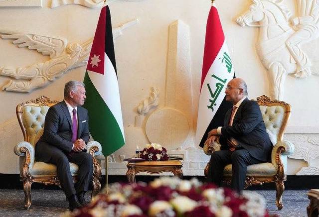 The Iraqi president assures the Jordanian king the importance of strengthening joint cooperation