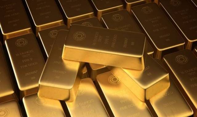 Gold slides, heads for second weekly drop