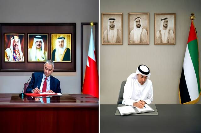 Khaled Mohamed Balama, Governor of the CBUAE, and  Khalid Humaidan, Governor of the CBB,