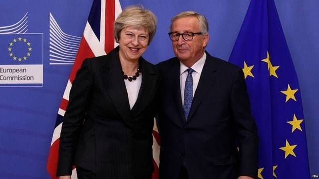 May, Juncker pledge to conclude Brexit talks before 21 March