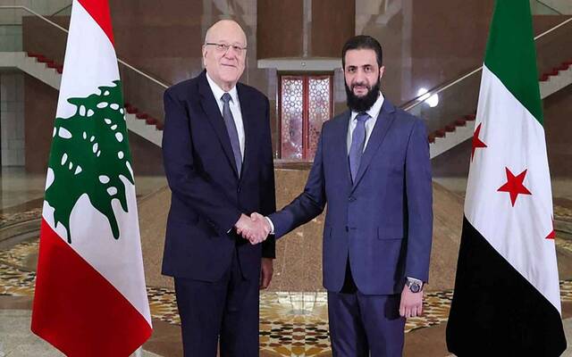 قائد إدارة العمليات العسكرية في سوريا أحمد الشرع ورئيس حكومة تصريف الأعمال في لبنان نجيب ميقاتي