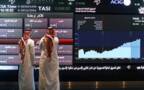 متعاملان فى سوق الأسهم السعودية