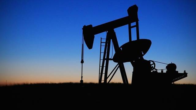 Oil slips on US stockpile build-up, slowing economic growth