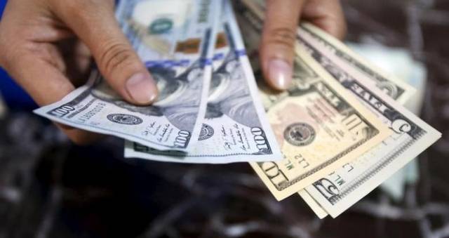 US dollar hits 13M high on positive data