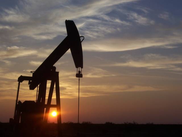 Oil edges higher on OPEC output curbs, Iran, Venezuela sanctions